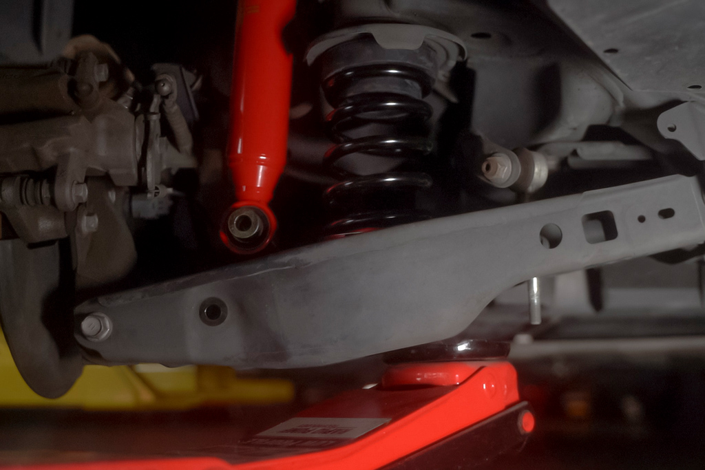 Rear suspension height adjustment